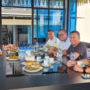 Gubernur Ansar Ahmad berdiri di depan backdrop acara welcome party di Batam